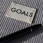 Goals - black and silver pen on gray textile