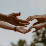 Intimacy - a group of people reaching out their hands