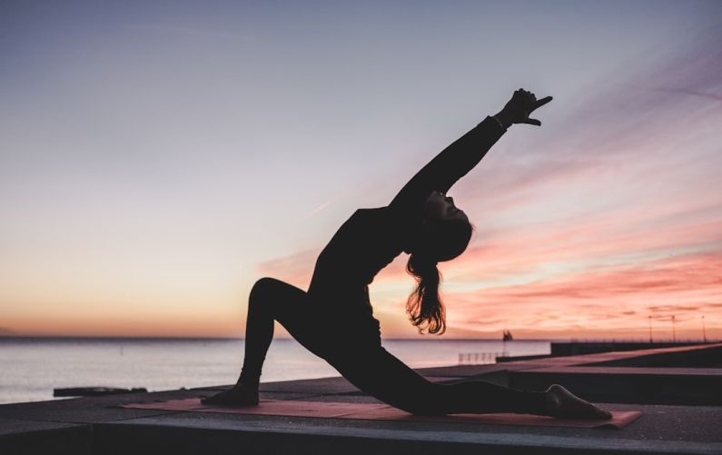 Yoga - silhouette photography of woman doing yoga
