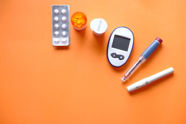 Diabetes - white digital device beside white pen