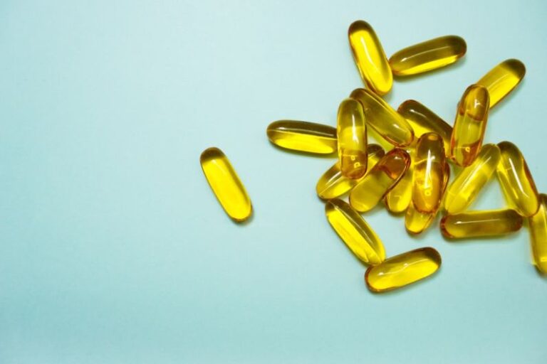 Omega-3 - brown and yellow medication tablets