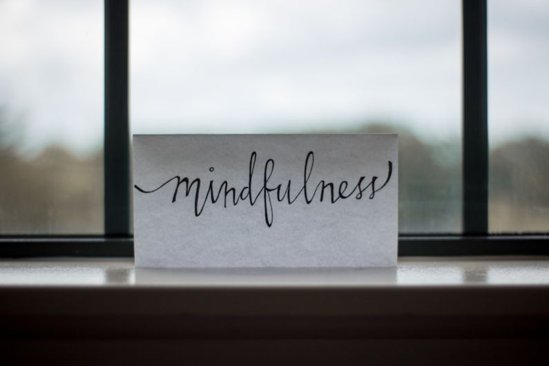 Mindfulness - mindfulness printed paper near window